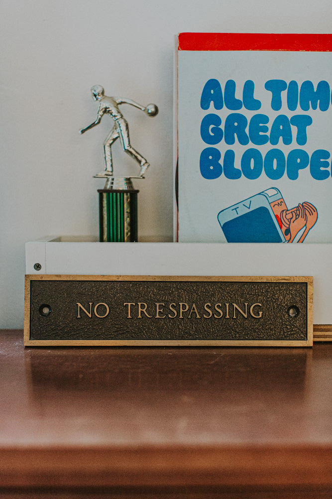Brass "No Trespassing" sign